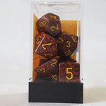 speckled red dice in transparent container with a white background
